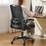 Upgrade your workspace with this ergonomic office chair, designed for comfortable long-hour sitting. It features adjustable lumbar support, breathable mesh construction, flip-up armrests, and a supportive design suitable for home offices, computer desks, study areas, and gaming setups. The sleek black finish gives it a professional look while keeping your workspace comfortable and organized. Key Features: Adjustable lumbar support Breathable mesh backrest Flip-up armrests for flexible positioning Ergonomic design for extended sitting Comfortable padded seat Suitable for home office, computer desk, and gaming Stylish black finish